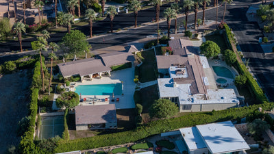 Aerial view of homes and palm-lined streets beside the Thunderbird racquet courts in Rancho Mirage, photographed by Mark Miller on October 13, 2026