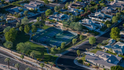 Pickleball and basketball courts beside landscaped grounds and homes at Victoria Falls in Rancho Mirage.
