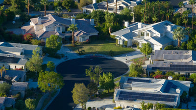 Victoria Falls homes around a landscaped cul-de-sac, showing tiled roofs and private yards.