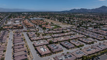 Panoramic aerial view of Villa Portofino and the surrounding Palm Desert neighborhoods and mountains. Photo by Mark Miller, September 10, 2026.