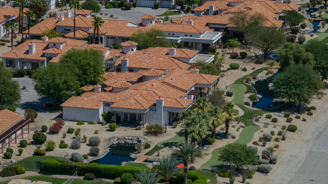 Aerial view of Villa Portofino's tile-roofed villas, landscaped paths and water features in Palm Desert. Photo by Mark Miller, September 10, 2026.
