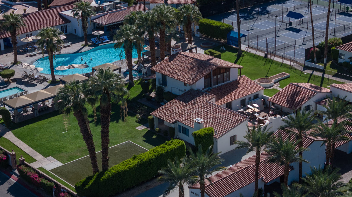Walter H. Morgan House at La Quinta Resort, showing its red-tile roofs, white stucco walls and adjacent lawn; photographed by Mark Miller on October 4, 2026.