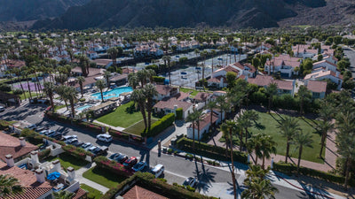 Wide aerial view of Walter Morgan's house within La Quinta Resort, with nearby pools, tennis courts, palms and Santa Rosa Mountains; Mark Miller, October 4, 2026.