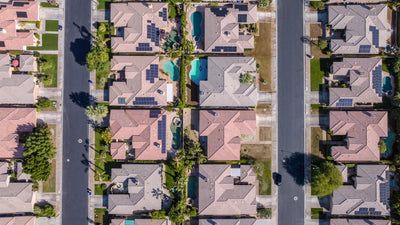 Overhead view of Whitehawk homes with private pools and solar panels